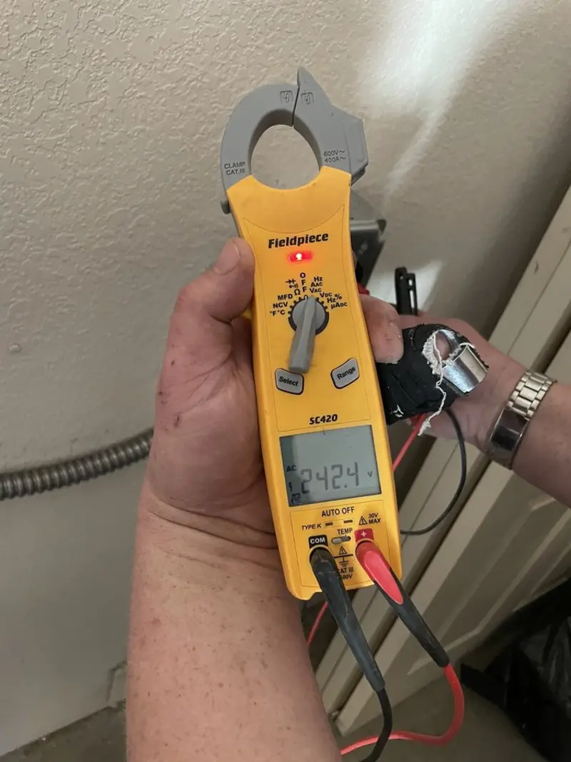 Voltage testing with clamp meter during Electrical Installation Services in Pavilion